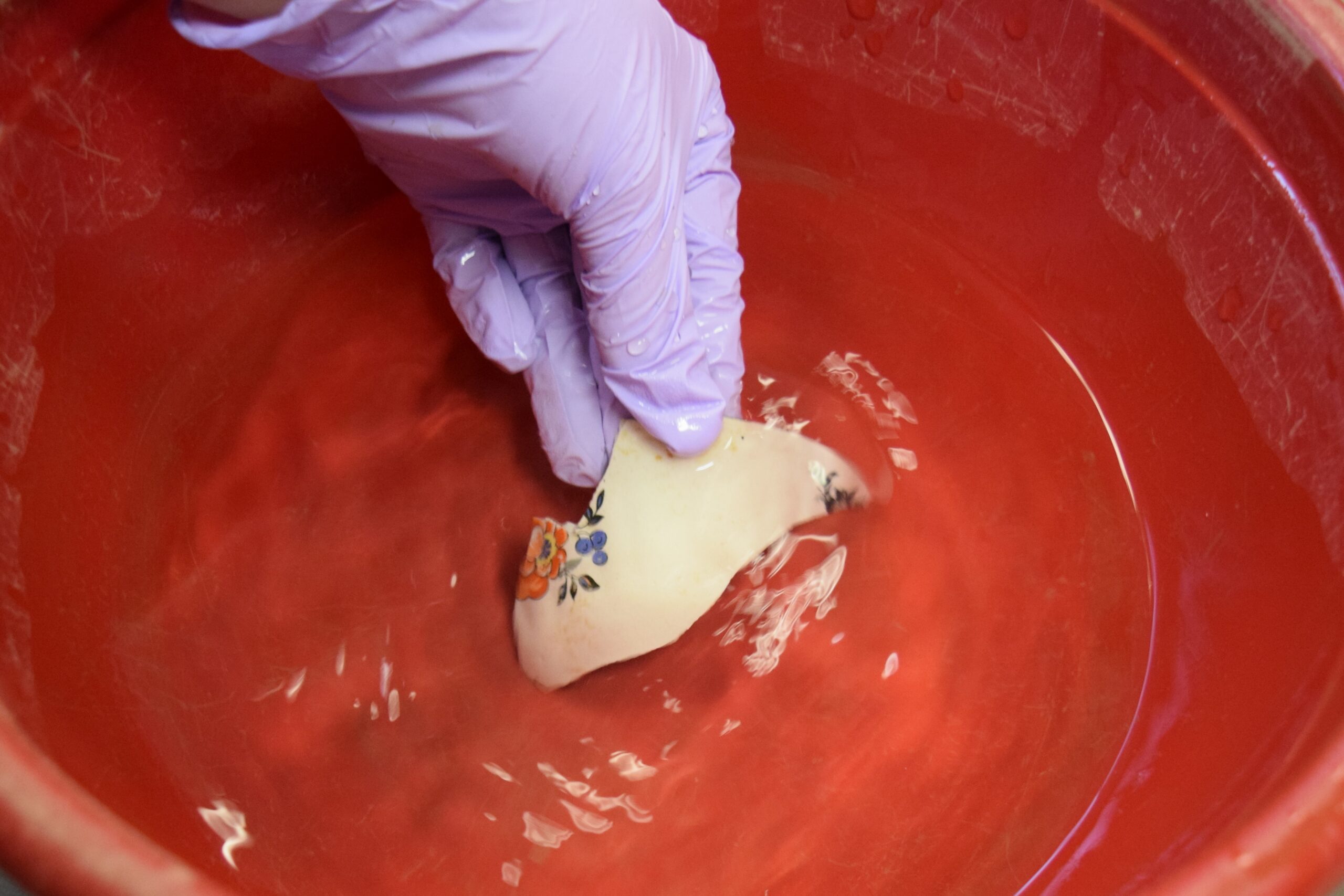 artifacts being rinsed in tap water